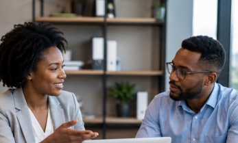 HR consultant advising a client in a one-on-one session